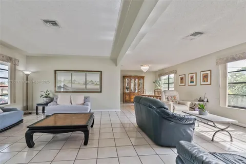 a living room with furniture rug and window