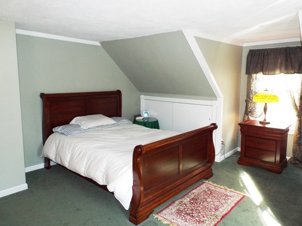 219 Prospect Street Ashland, MA 01721 - Photo 11 of 21 a bedroom with a bed and a dresser