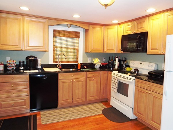 219 Prospect Street Ashland, MA 01721 - Photo 3 of 21 a kitchen with a sink a stove and cabinets