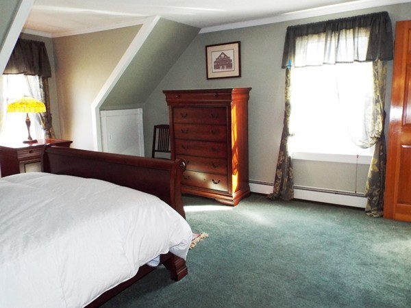 219 Prospect Street Ashland, MA 01721 - Photo 9 of 21 a bedroom with a bed and a window