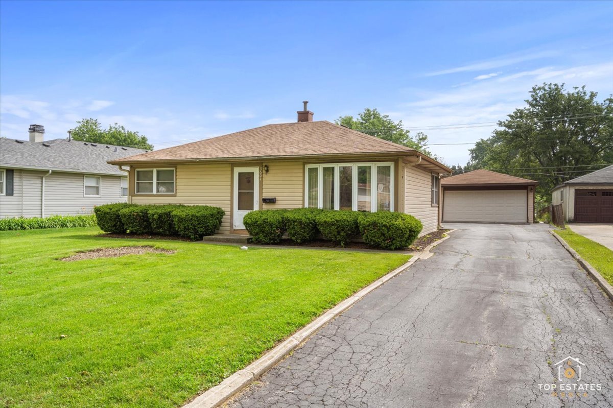 3604 Owl Drive Rolling Meadows, IL 60008 - Photo 1 of 43 a front view of a house with a garden
