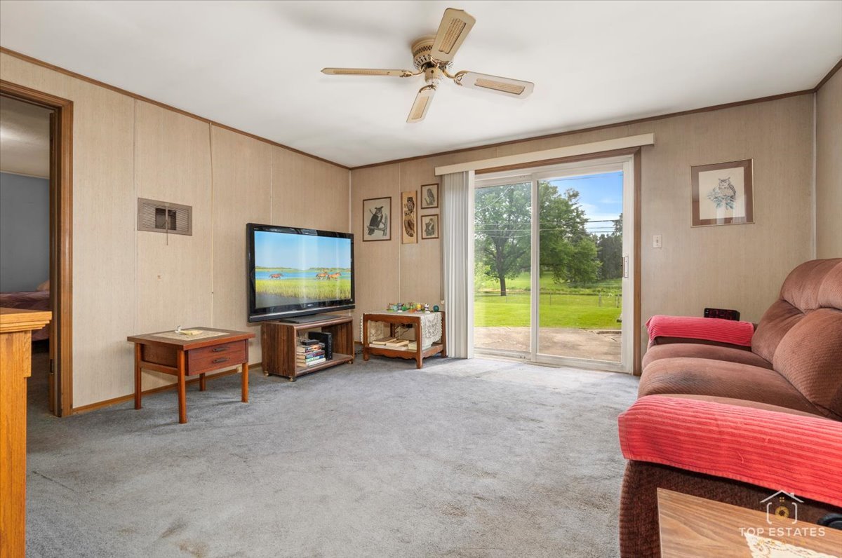 3604 Owl Drive Rolling Meadows, IL 60008 - Photo 11 of 43 a living room with furniture and a flat screen tv