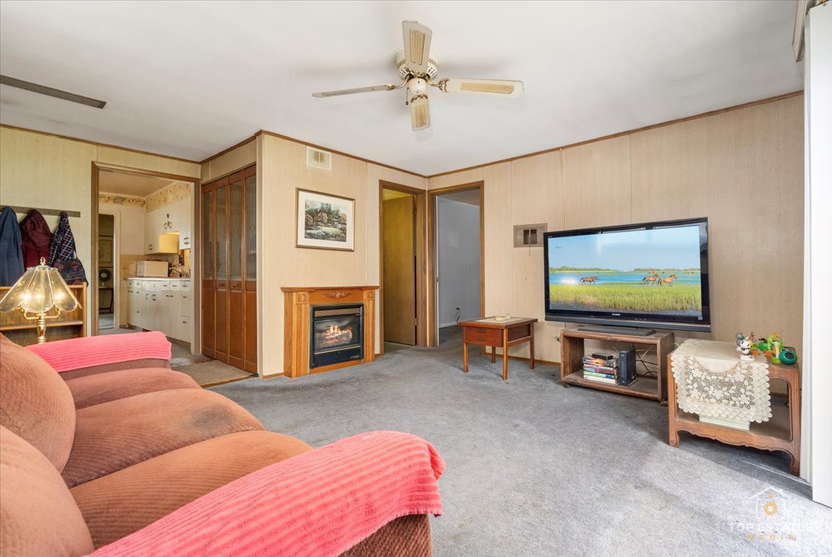 3604 Owl Drive Rolling Meadows, IL 60008 - Photo 13 of 43 a living room with furniture and a flat screen tv