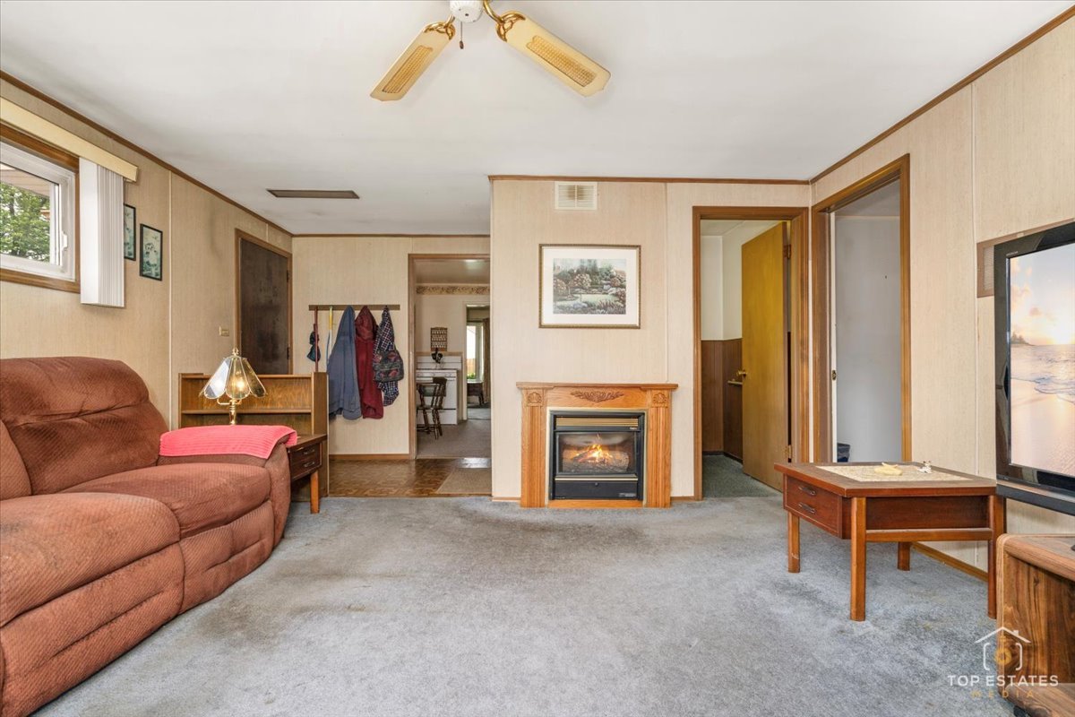 3604 Owl Drive Rolling Meadows, IL 60008 - Photo 14 of 43 a living room with furniture and a fireplace