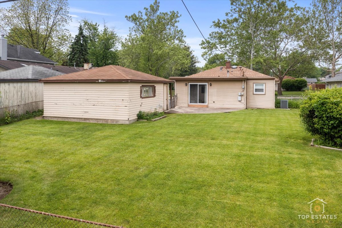 3604 Owl Drive Rolling Meadows, IL 60008 - Photo 29 of 43 a white house that has a tree in front of it