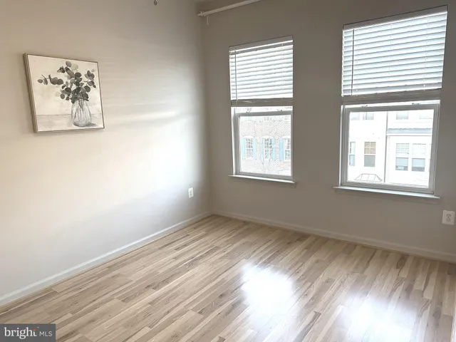 a view of room with window and hardwood floor