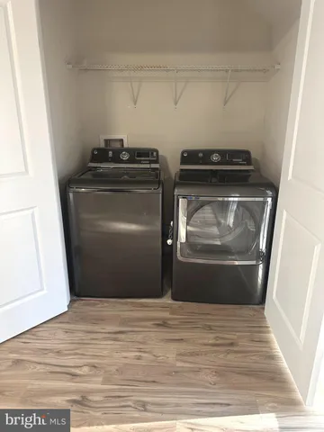 a view of balcony with wooden floor