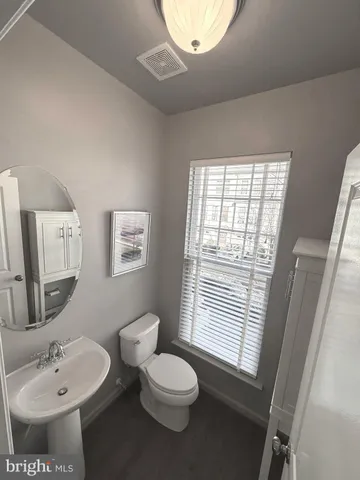 a bathroom with a sink toilet and tub