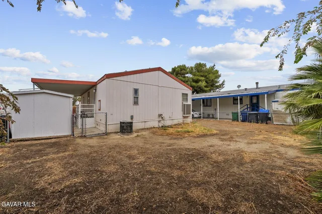 a view of a house with a yard and garage