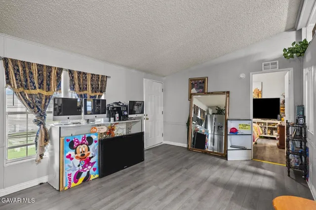 a kitchen with stainless steel appliances granite countertop a sink and a stove