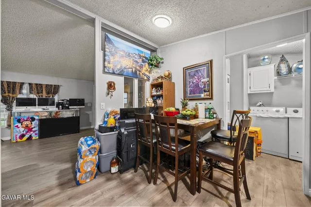 a kitchen with white cabinets and sink