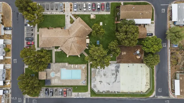 an aerial view of a house with swimming pool