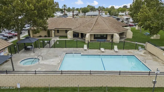 a view of a backyard with sitting area