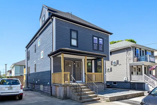 a view of a house with a large window and wooden floor