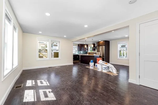 a bathroom with a sink mirror and toilet
