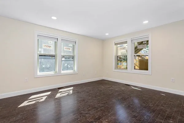 a living room with stainless steel appliances kitchen island furniture and a kitchen view