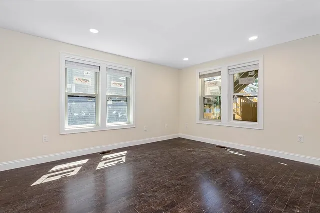 a living room with stainless steel appliances kitchen island furniture and a kitchen view