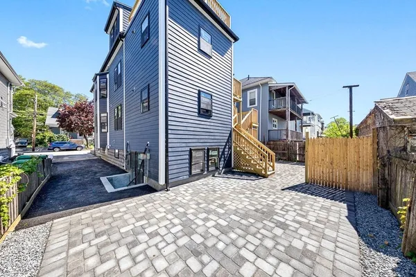 a view of a house with a sink and a yard