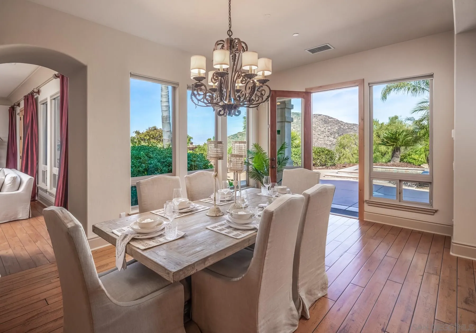 13445 Highlands Ranch Road Poway, CA 92064 - Photo 13 of 29 a view of a dining room with furniture wooden floor and chandelier