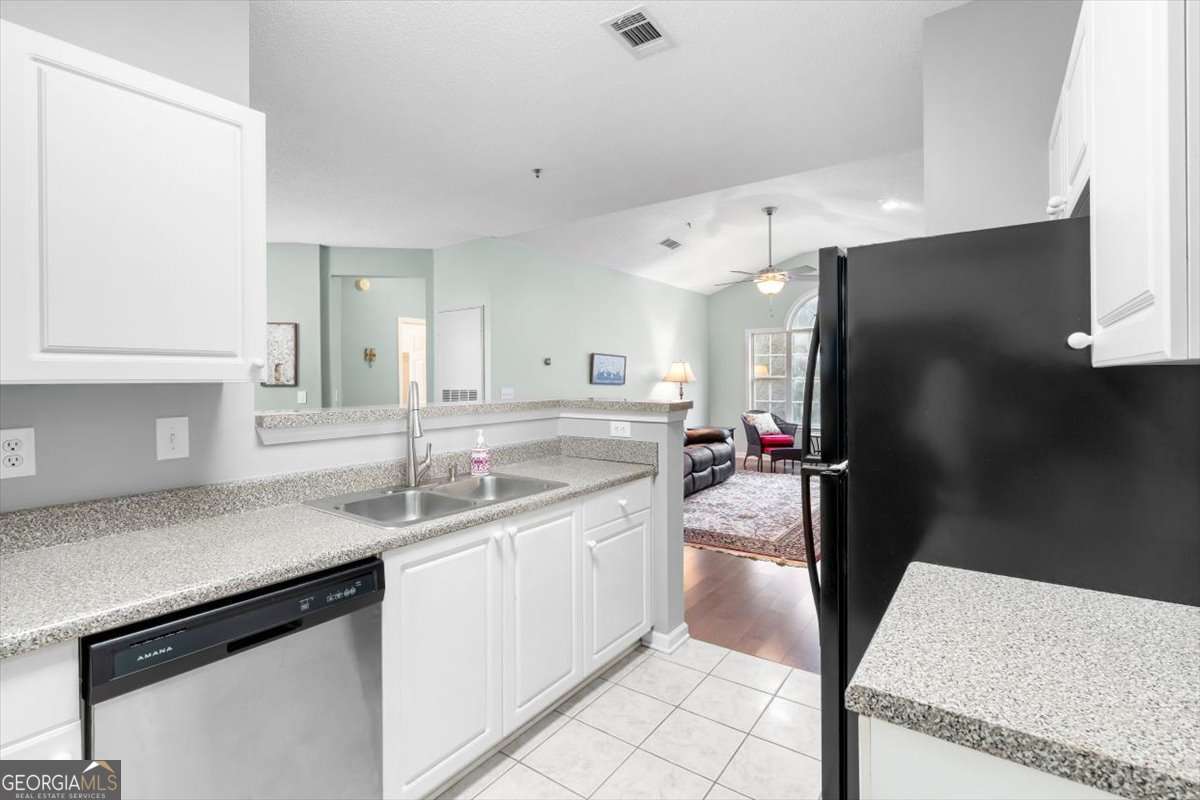 803 Spring Heights Lane, Unit 8 Smyrna, GA 30080 - Photo 15 of 46 a kitchen with a sink appliances and cabinets
