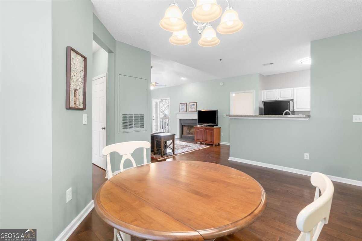 803 Spring Heights Lane, Unit 8 Smyrna, GA 30080 - Photo 19 of 46 a view of a dining room with furniture