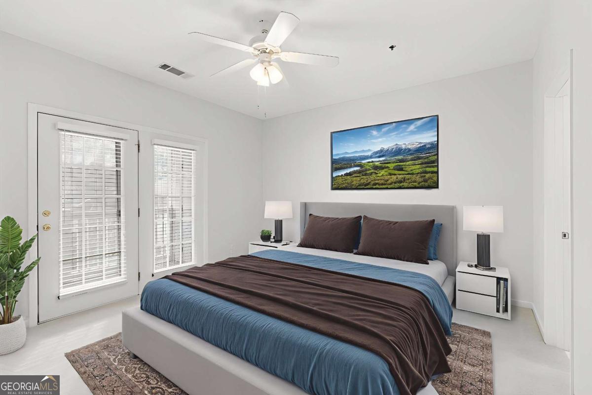 803 Spring Heights Lane, Unit 8 Smyrna, GA 30080 - Photo 21 of 46 a bedroom with a large bed and a window