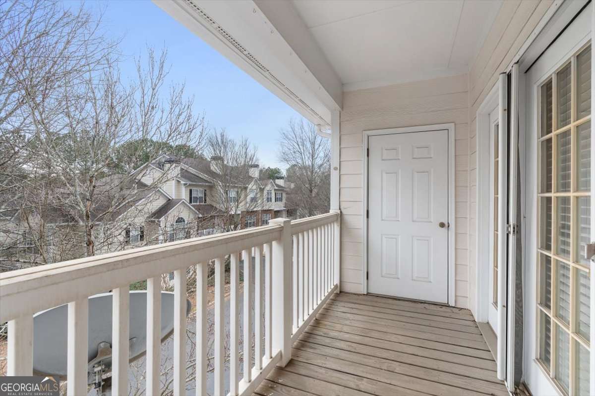 803 Spring Heights Lane, Unit 8 Smyrna, GA 30080 - Photo 30 of 46 a view of a balcony with wooden floor