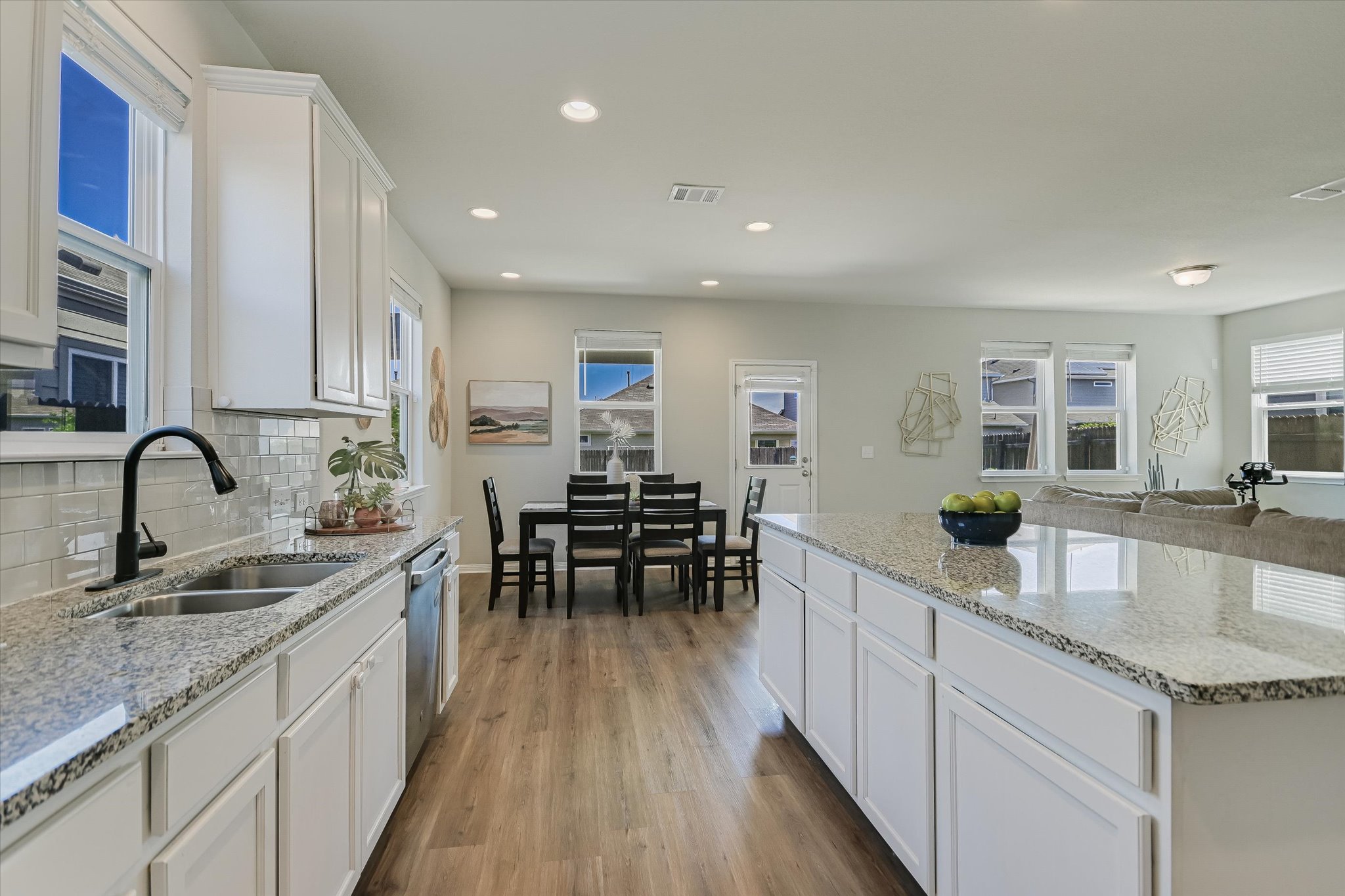6304 Gunflint Drive Austin, TX 78747 - Photo 9 of 28 Wide open and connected, because the best conversations always happen near the kitchen.