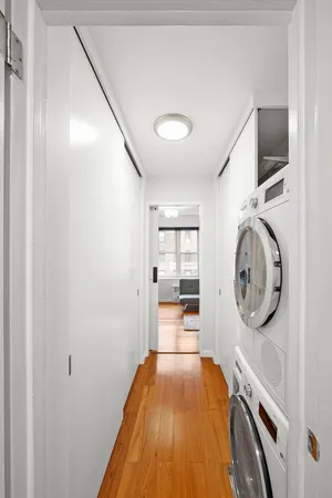a view of a hallway with washer and dryer