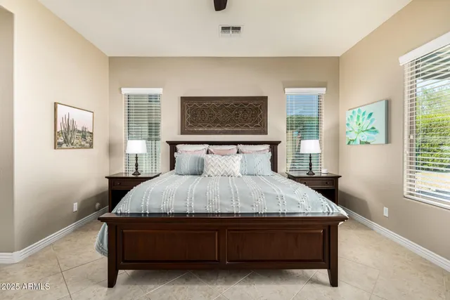 a bathroom with a tub a sink and mirror
