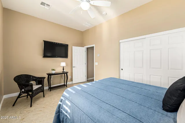 a bathroom with a double vanity sink toilet and shower