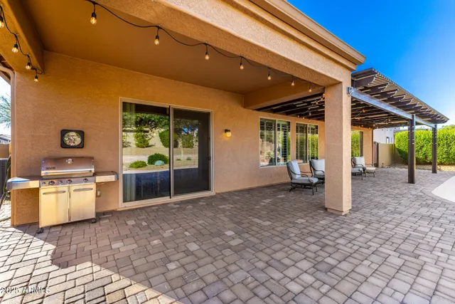 a view of swimming pool with outdoor seating