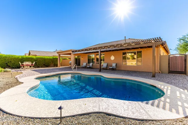 a view of a house with wooden fence