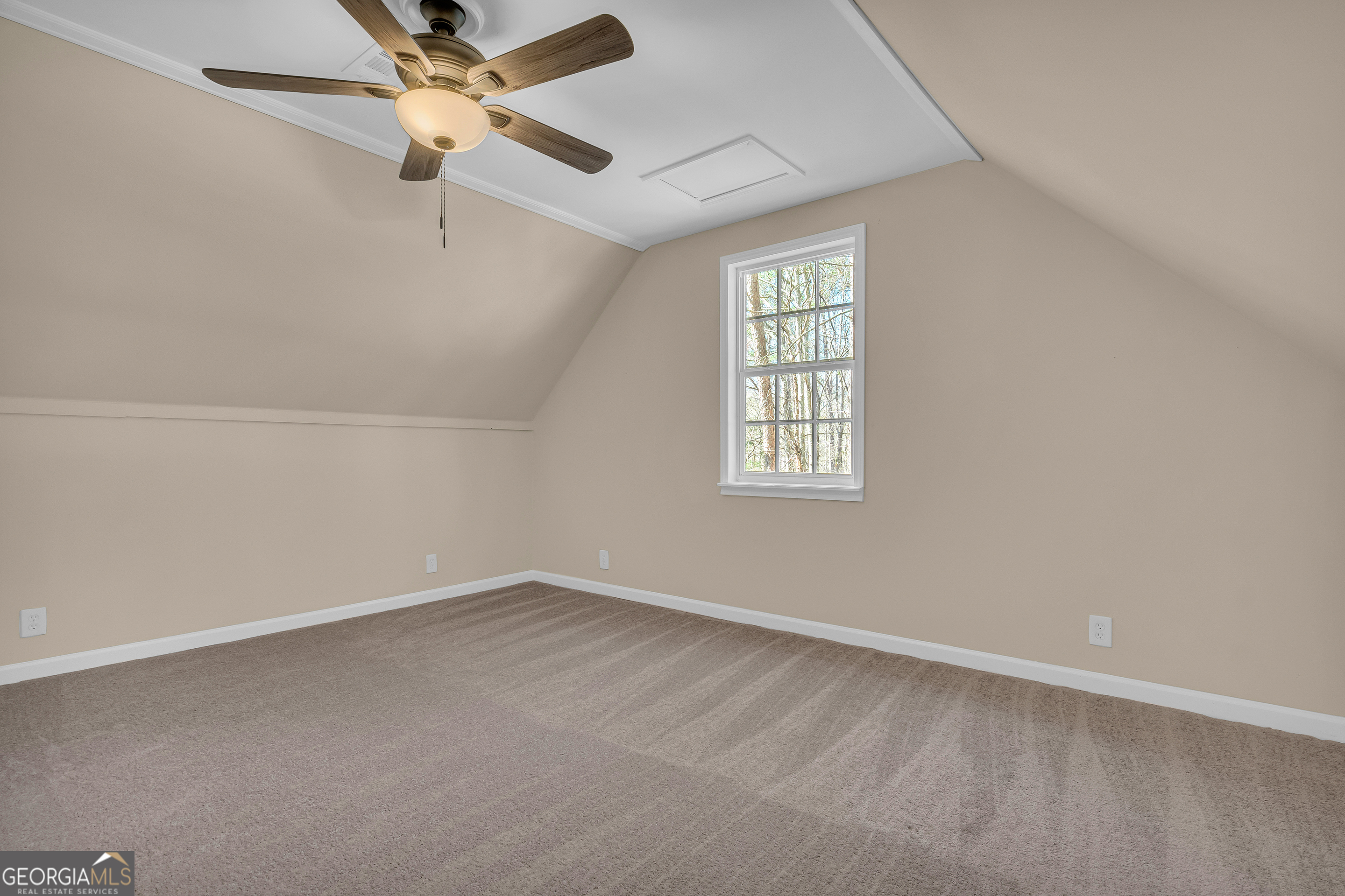 694 Lovers Lane Toccoa, GA 30577 - Photo 11 of 50 an empty room with windows and fan