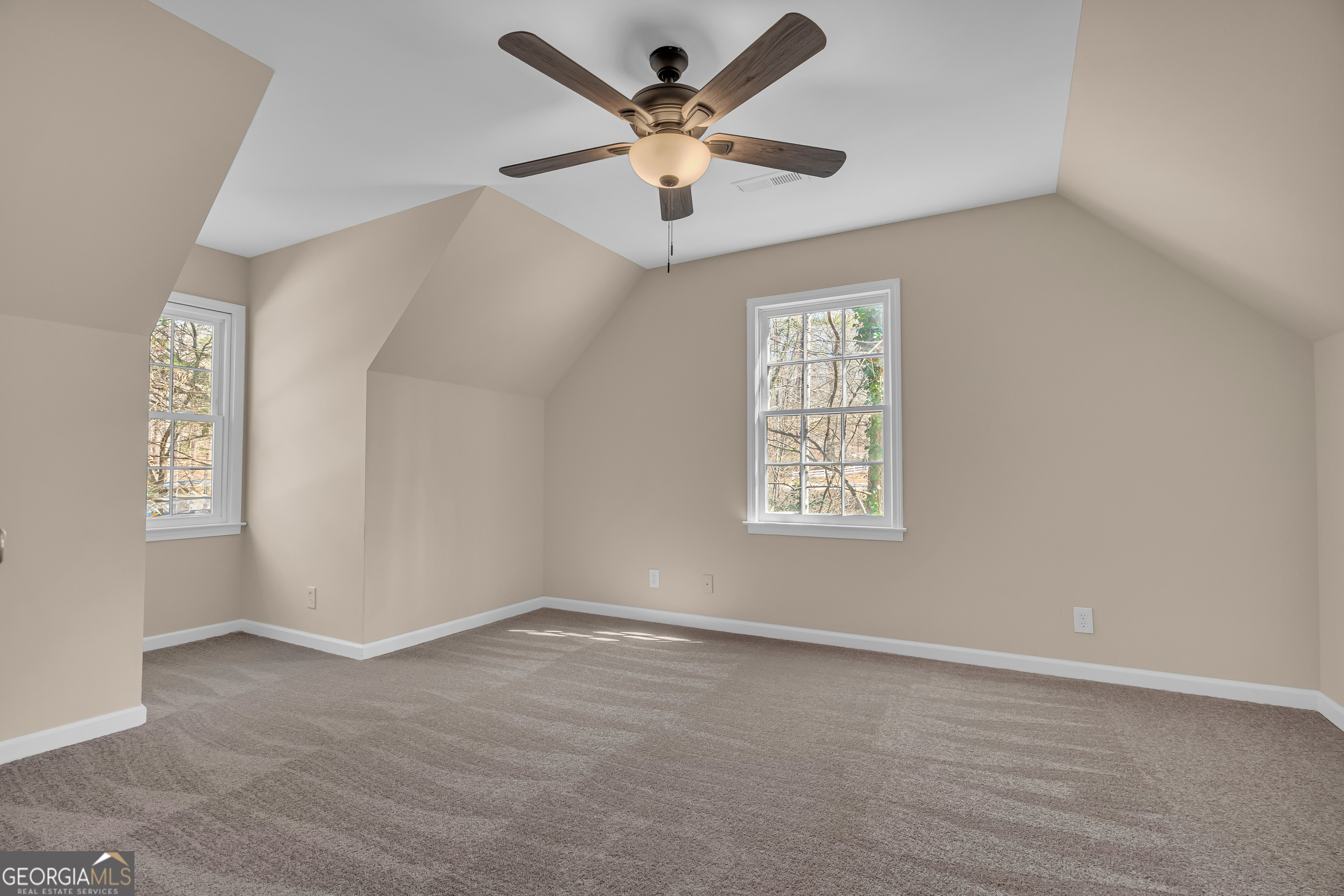 694 Lovers Lane Toccoa, GA 30577 - Photo 12 of 50 an empty room with fan and windows