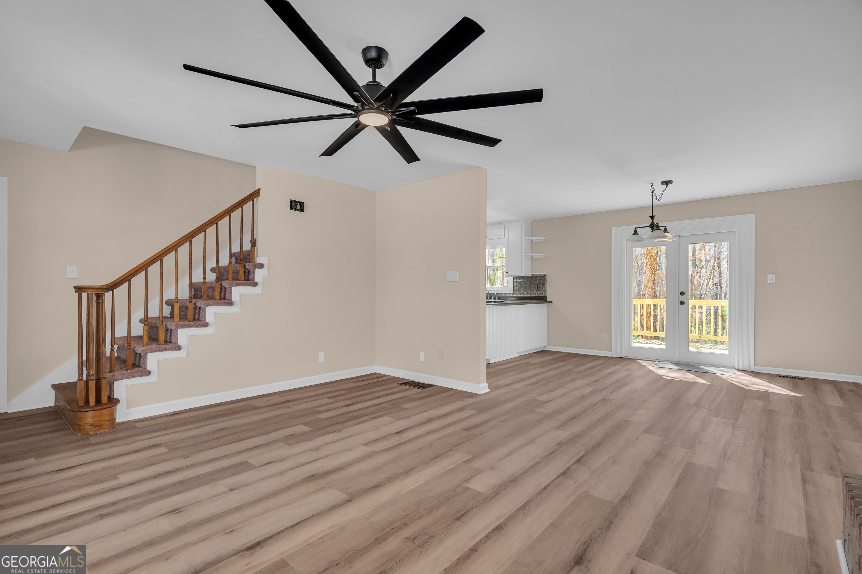 694 Lovers Lane Toccoa, GA 30577 - Photo 23 of 50 a view of an empty room with wooden floor and a window