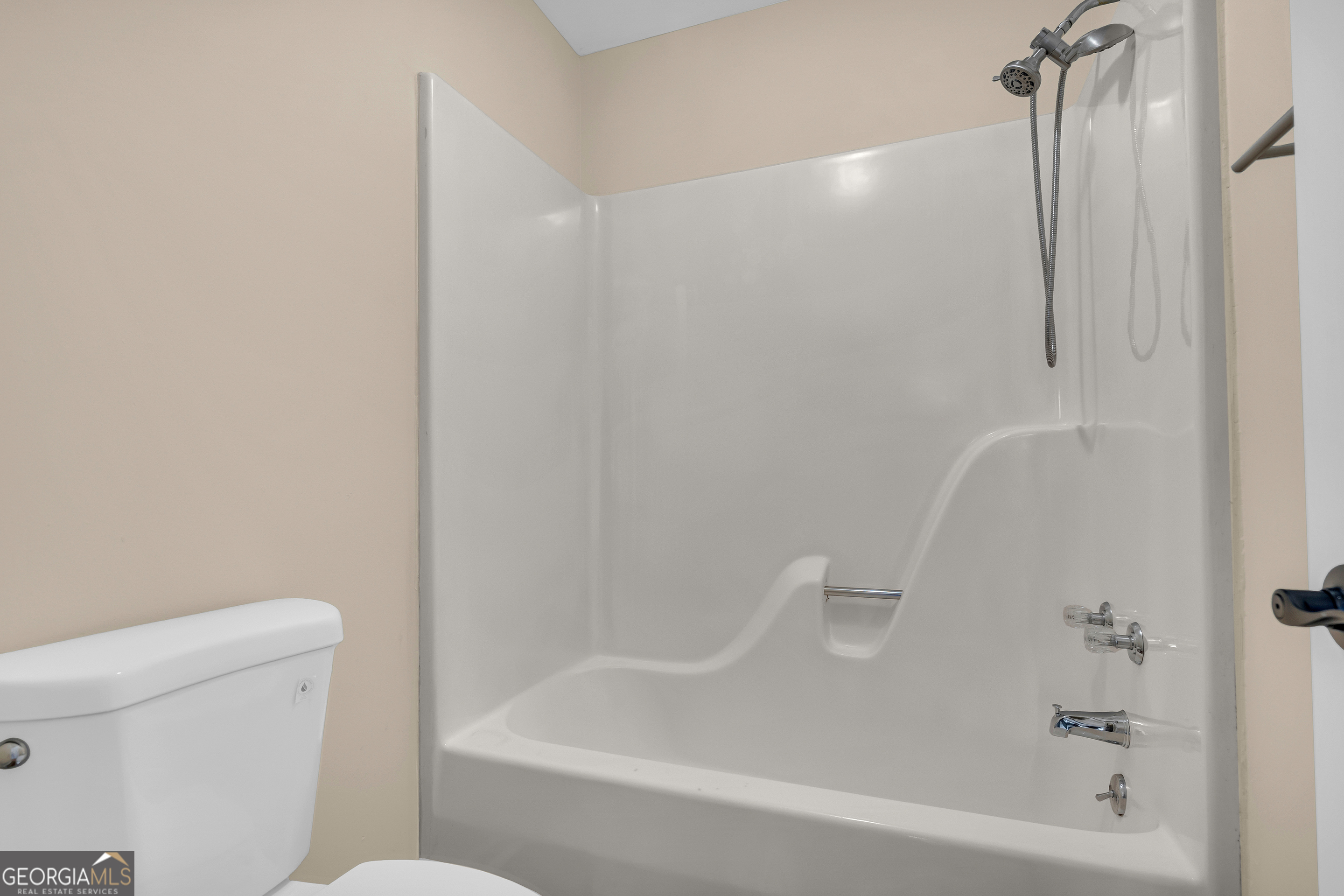 694 Lovers Lane Toccoa, GA 30577 - Photo 32 of 50 a bathroom with a bathtub and a toilet