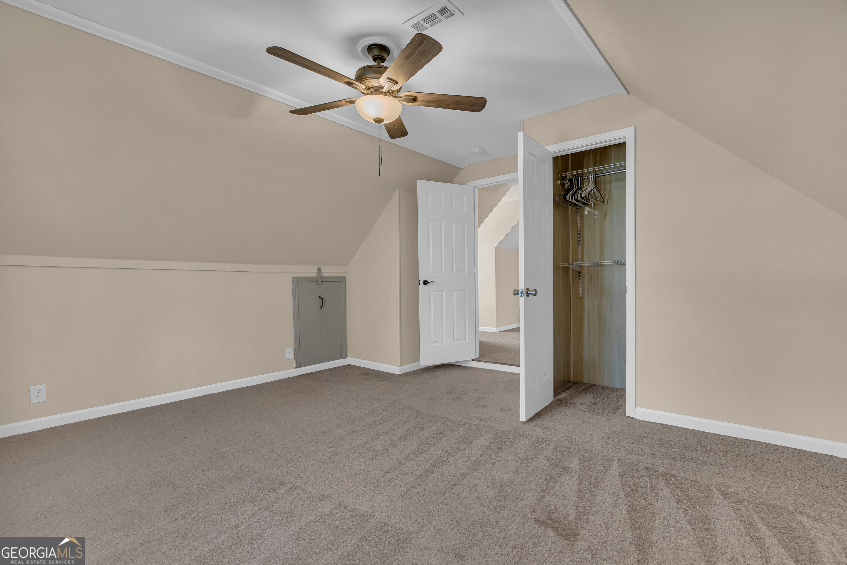 694 Lovers Lane Toccoa, GA 30577 - Photo 40 of 50 an empty room with a ceiling fan and a window