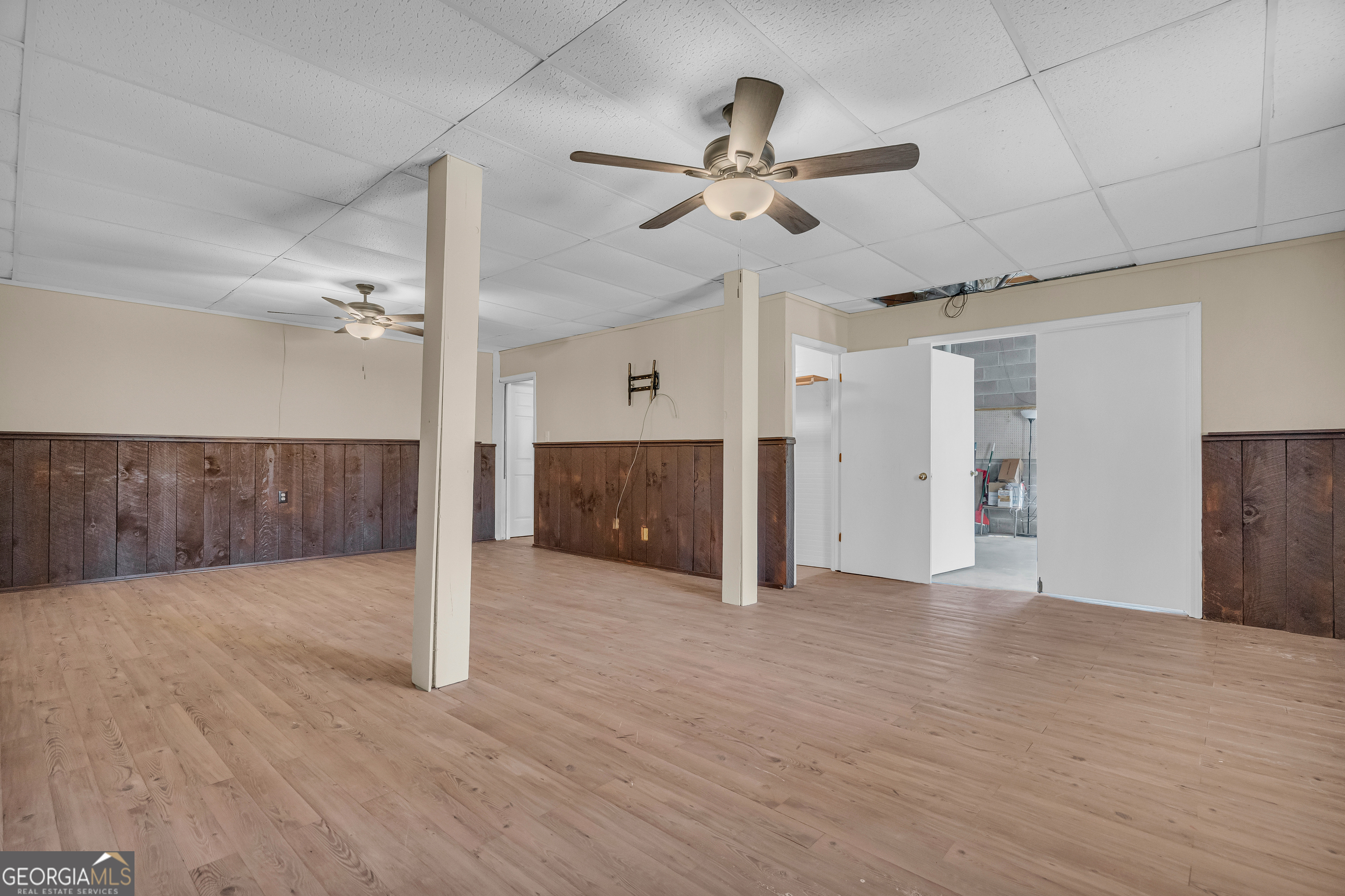 694 Lovers Lane Toccoa, GA 30577 - Photo 49 of 50 a view of a livingroom with a ceiling fan and hardwood floor