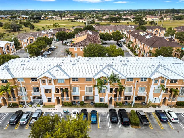 an aerial view of residential houses and outdoor space