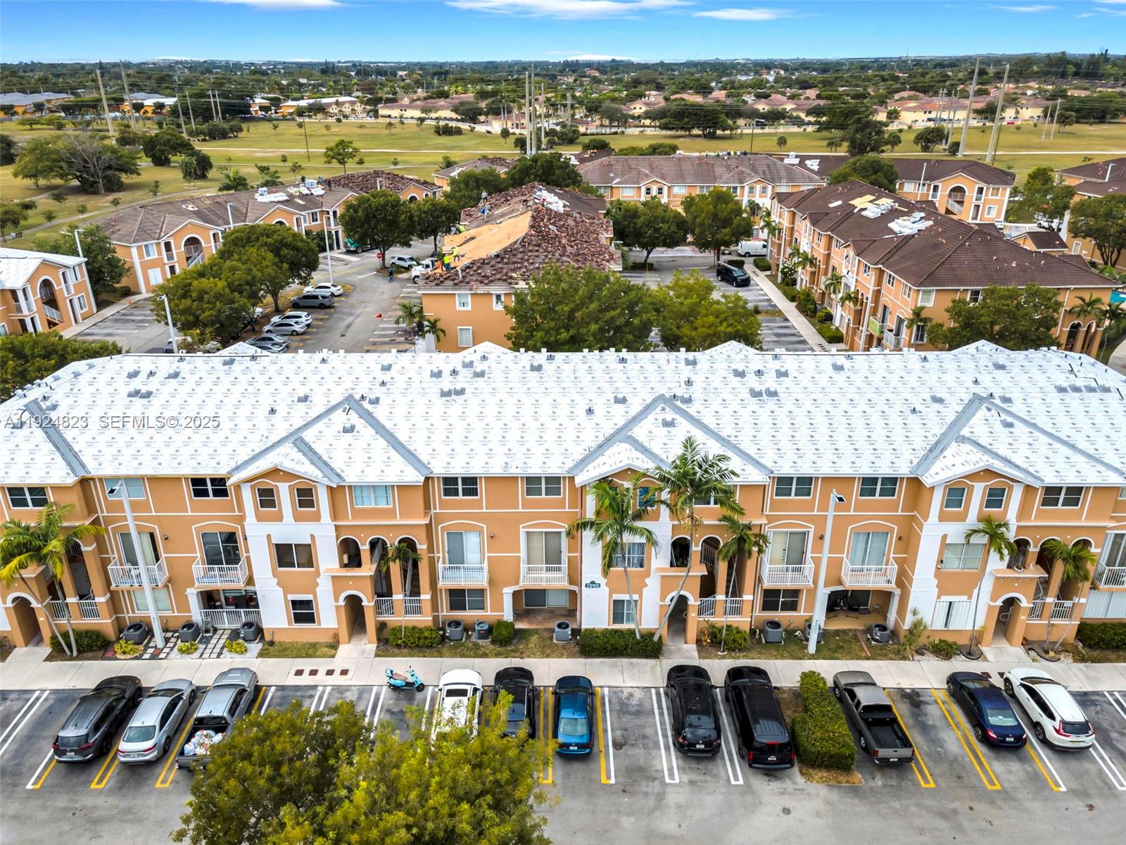 an aerial view of residential houses and outdoor space