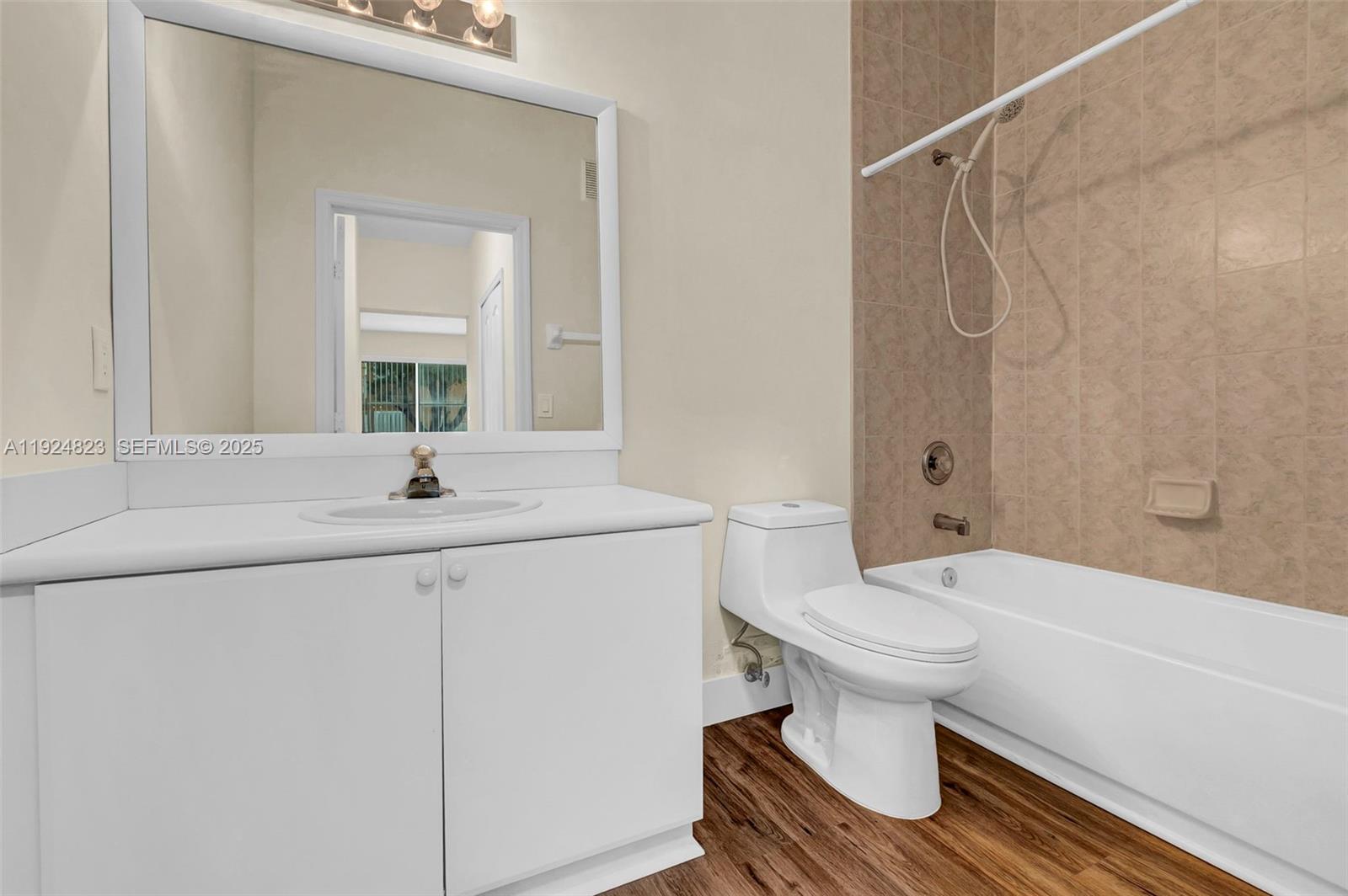 7250 Northwest 177th Street, Unit 10216 Hialeah, FL 33015 - Photo 15 of 23 a bathroom with a sink toilet and shower