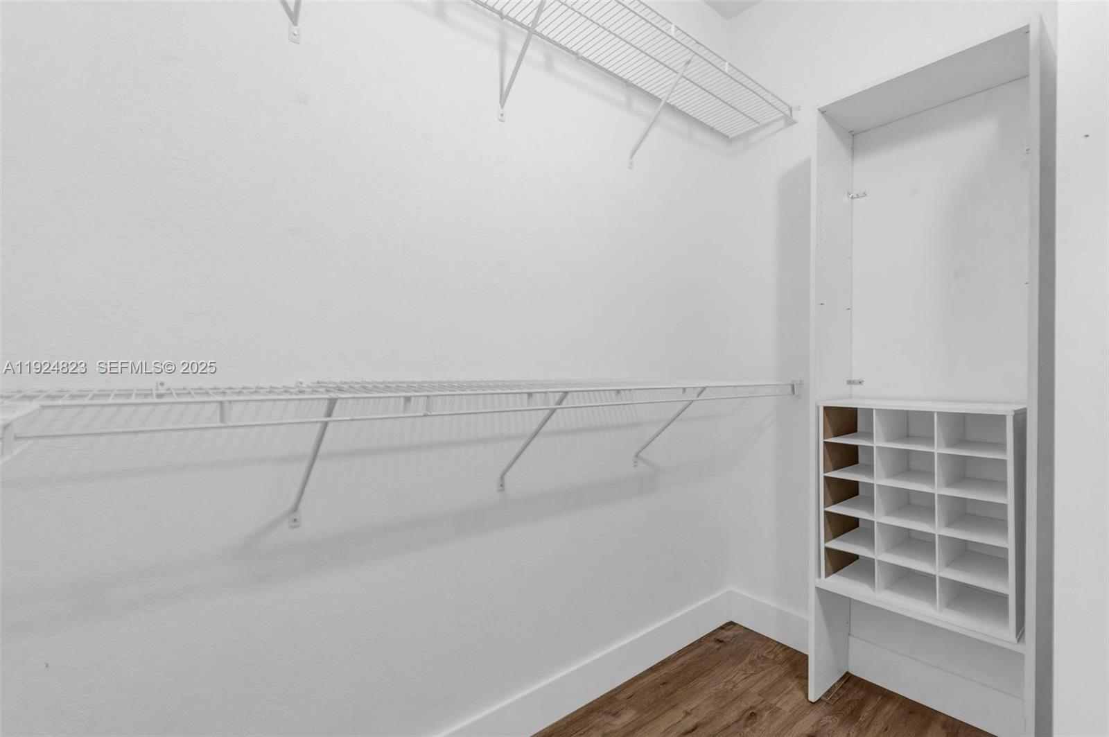 7250 Northwest 177th Street, Unit 10216 Hialeah, FL 33015 - Photo 18 of 23 a view of a room with racks on the wall