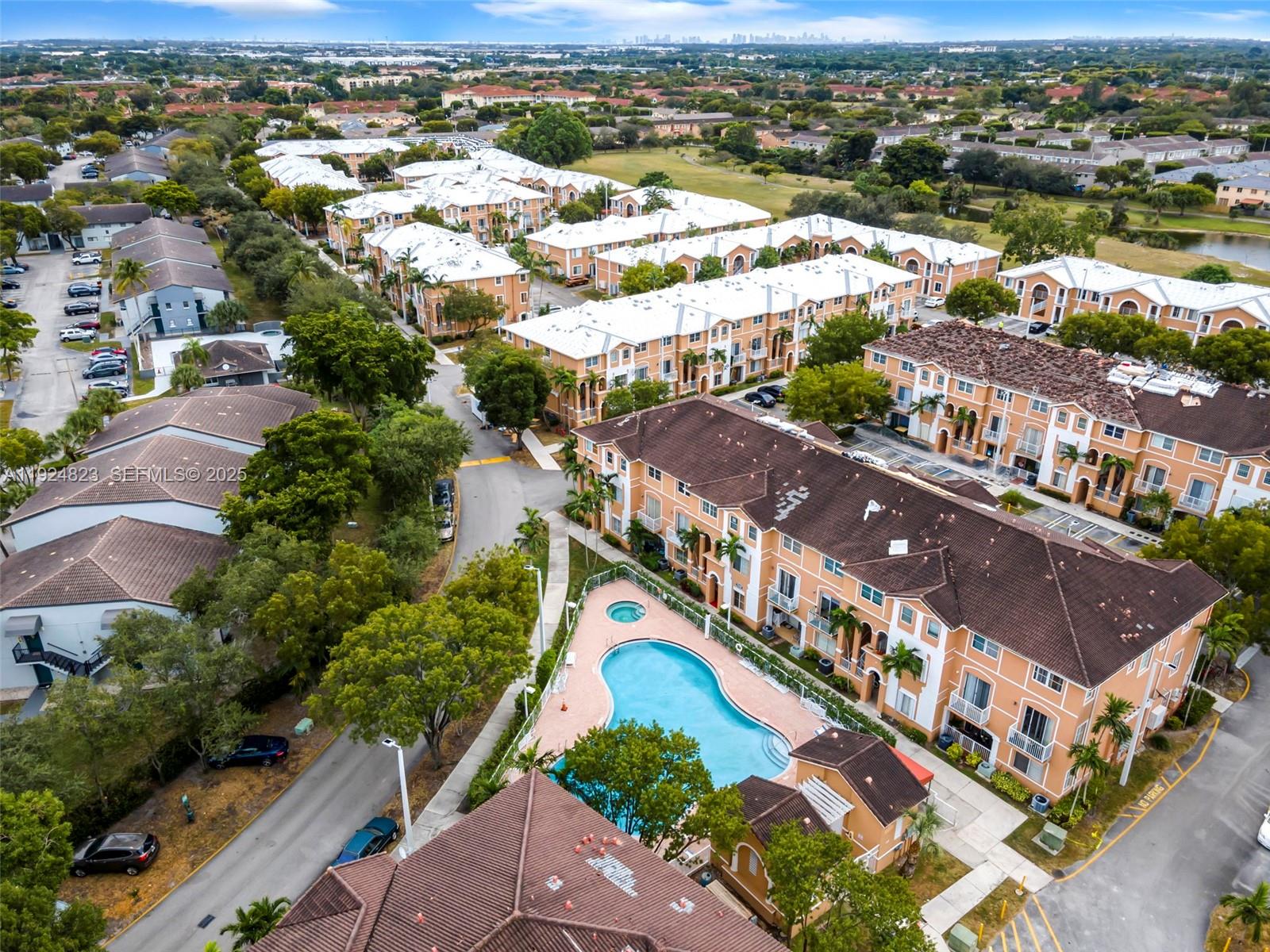 7250 Northwest 177th Street, Unit 10216 Hialeah, FL 33015 - Photo 21 of 23 an aerial view of residential houses with outdoor space