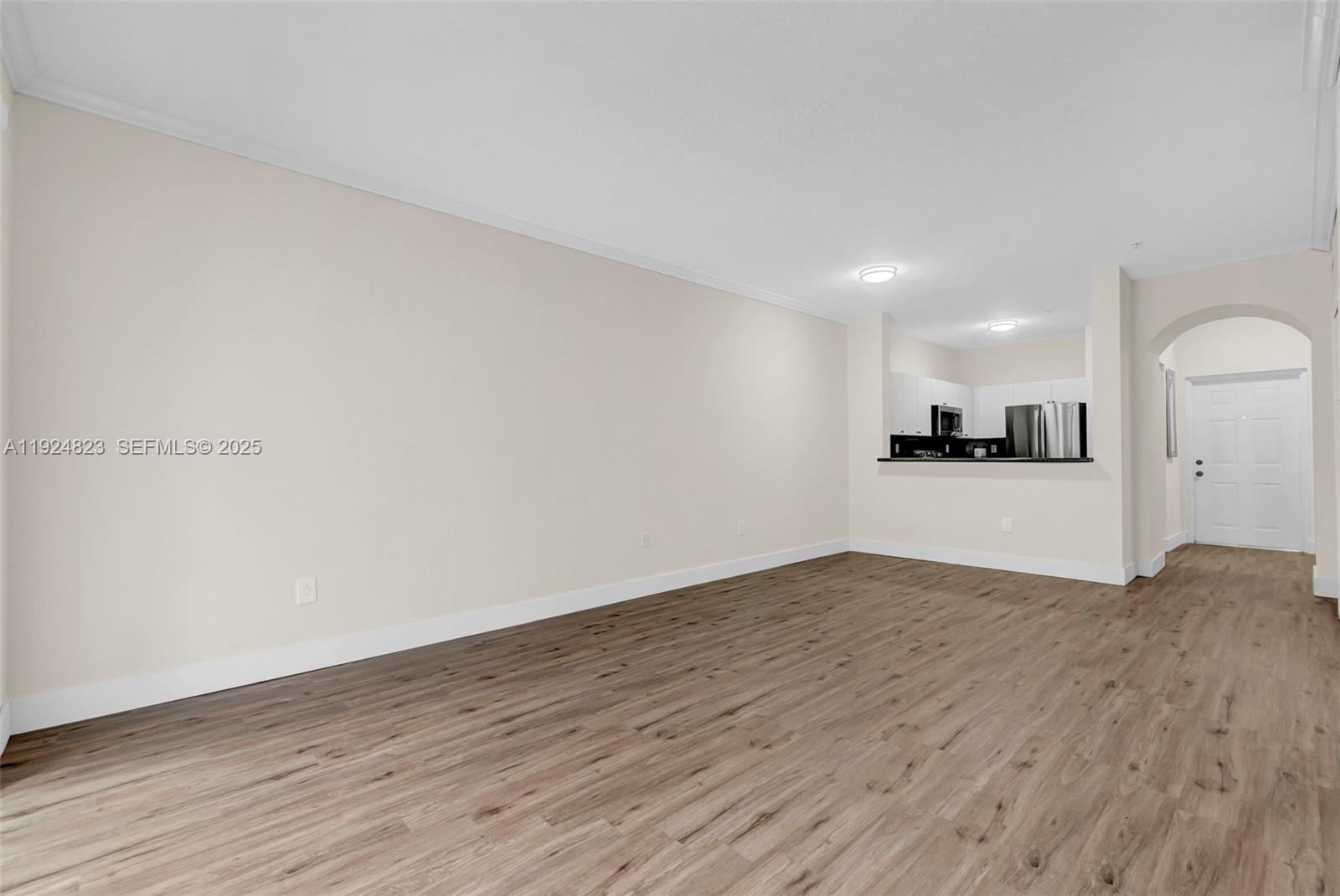 7250 Northwest 177th Street, Unit 10216 Hialeah, FL 33015 - Photo 8 of 23 a view of a kitchen with a sink and a refrigerator