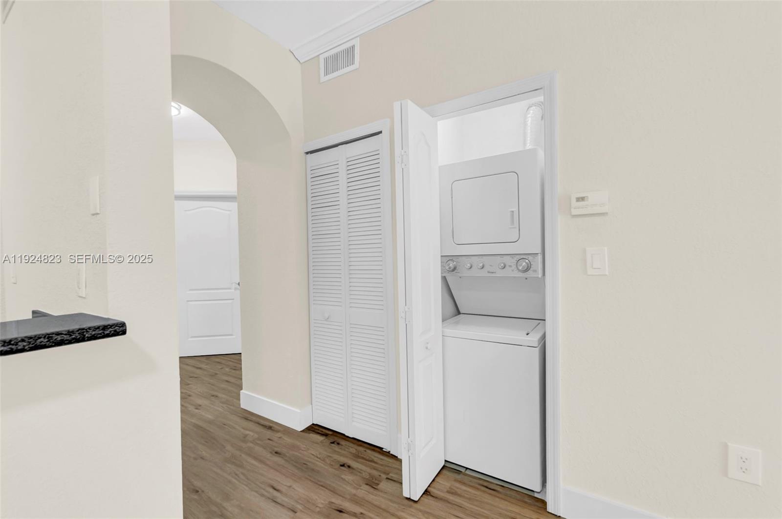7250 Northwest 177th Street, Unit 10216 Hialeah, FL 33015 - Photo 10 of 23 a walk in closet with wooden floor