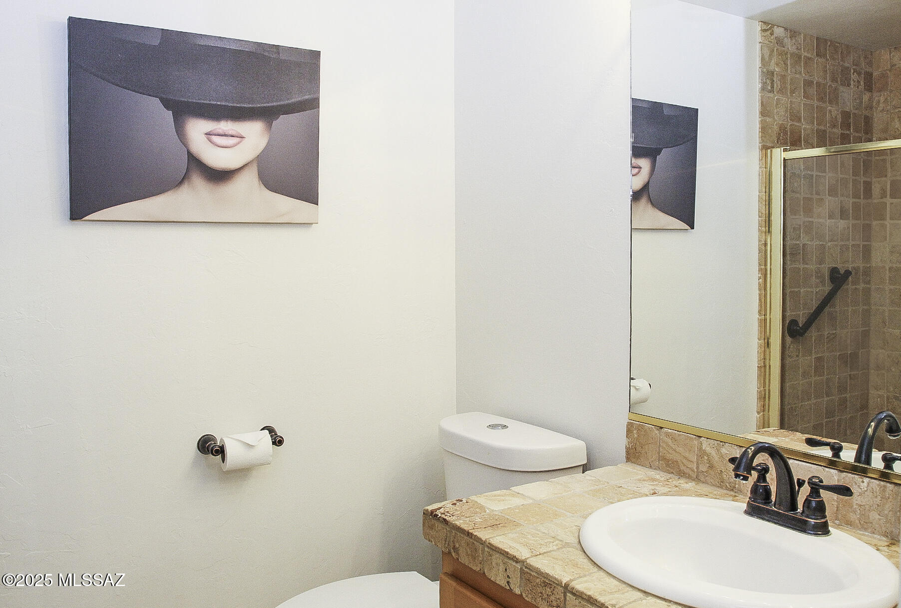 5202 Spring View Drive Tucson, AZ 85749 - Photo 22 of 49 a bathroom with a toilet sink and mirror