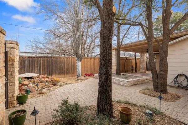 a backyard of a house with seating space