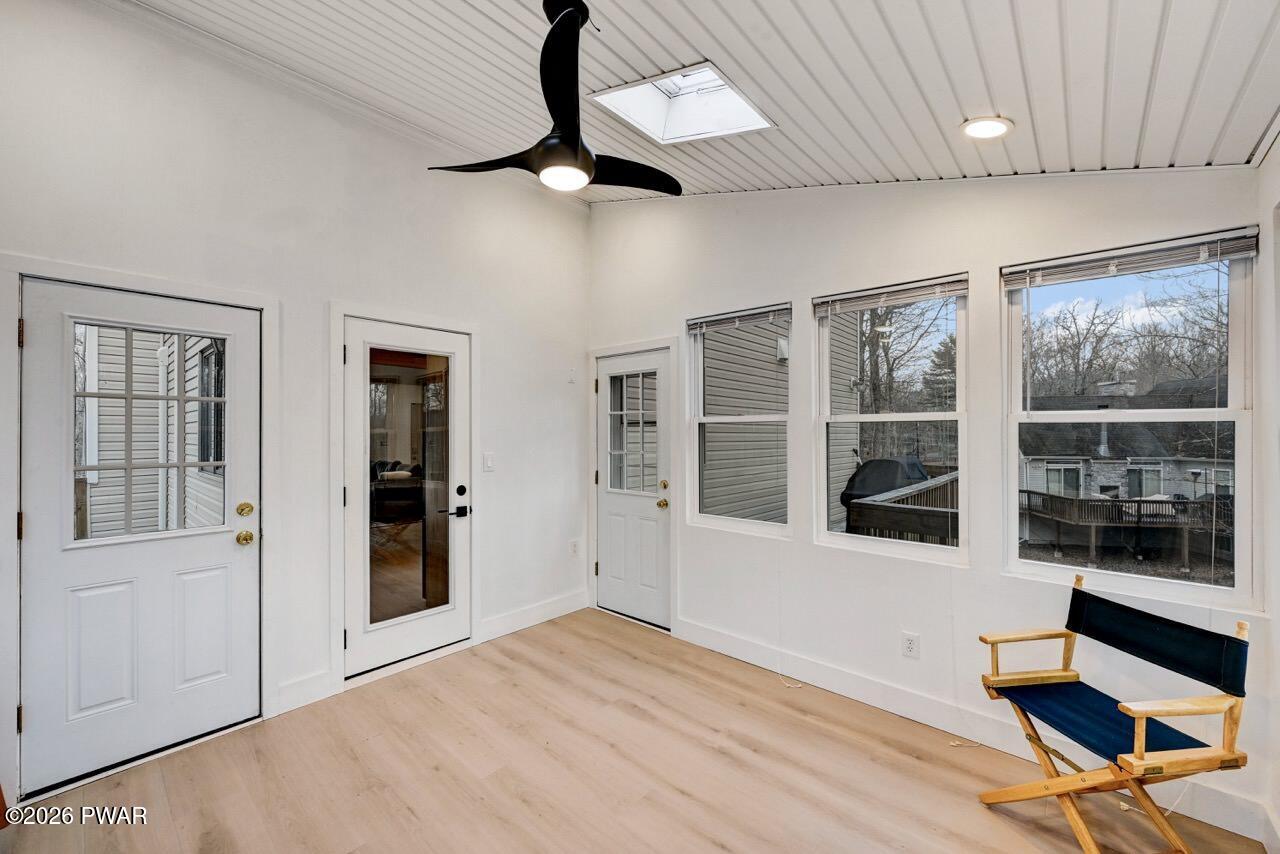 258 Lakeview Road Lackawaxen, PA 18435 - Photo 27 of 119 a view of an empty room with a window and wooden floor