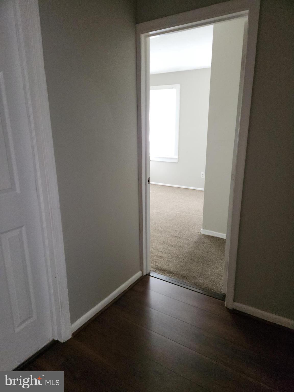 2204 North Jefferson Street, Unit 2 Wilmington, DE 19802 - Photo 6 of 10 an empty room with wooden floor and closet